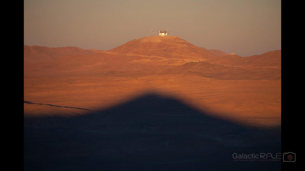 Paranal with the VLTs eclipsing Armazones with the ELT at sunset